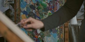 person painting in a serene art studio